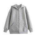 Chaqueta informal holgada de algodón con capucha y cremallera para mujer.